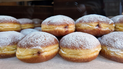 Delicious filled pastries displayed in a bakery window