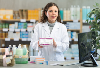 Positive female pharmacist offers to buy feminine pads