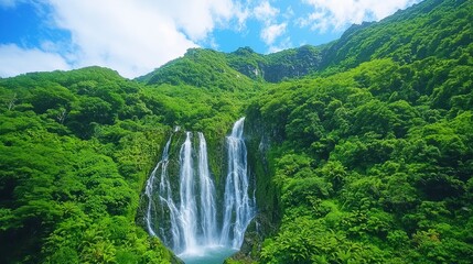 Fototapeta premium Cascading Waterfall in Lush Tropical Foliage
