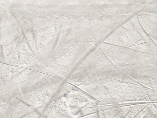 Ice background with marks from skating and hockey. Ice hockey rink scratches surface