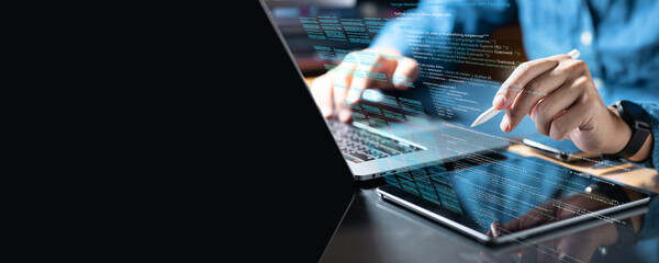 .Professional working with digital tablet and writing computer code language.For creative work such...