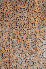 traditional Uzbek carved pattern kandakori on vintage wooden door in Tashkent in Uzbekistan close-up
