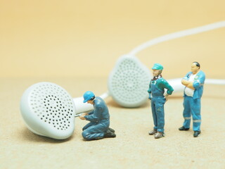 Mini toy of action figure at table with blurred background. Toy photography concept design. Music...