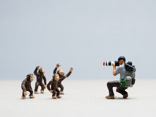 Mini toy of action figure at table with blurred background. Macro toy photography concept design....
