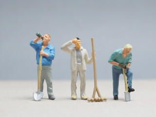 Mini toy of action figure at table with blurred background. Miniature photography concept design....