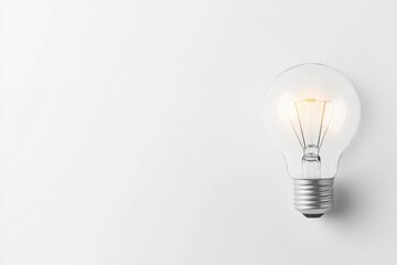 abstract lightbulb hanging in empty white space symbolic of creative ideas and insights with abundant copy space surrounding