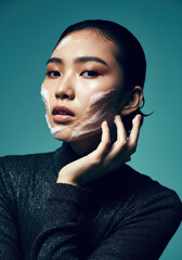 Artistic Skincare Concept with Cream on Woman’s Face