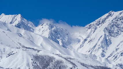 快晴の空と雪の北アルプス　長野県白馬村