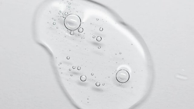 Close up of a Clear Liquid  Serum cosmetic product for skin. Gel texture with bubbles