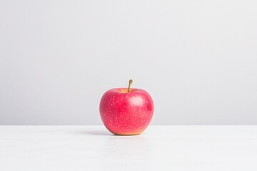 single vibrant resting on clean white surface minimalistic composition emphasizing simplicity harnessing pure essence