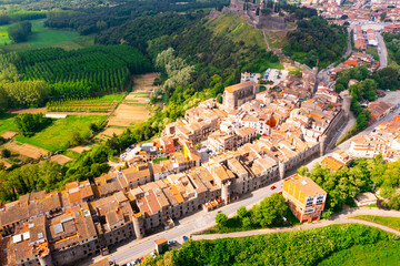 Fototapeta premium View from drone of spanish village Hostalric with Parish church of Santa Maria