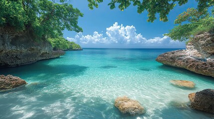 A serene view of a tropical sea cove, with crystal-clear water and a bright blue sky
