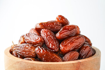 Dates fruit tunisia, Tunisian honey dates, in bowl isolated on white background