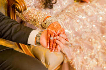 Bride and groom holding hand, Couple holding hands