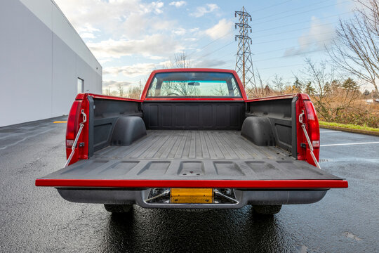 Portland, OR, USA &ndash; Dec 9, 2020 &ndash; 1990 red Chevrolet Silverado 1500 regular cab classic American pickup truck with open bed and tailgate, durable 4x4 off-road vehicle with liner and utility use
