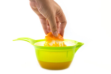 Prepare fresh squeezed orange juice with a green juice