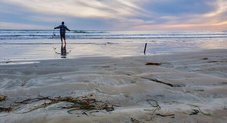 Silhouetted Fisherman at Long Bay Coorong SA at Sunset Beach
