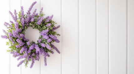 Beautiful Lavender Wreath Decorated with Greenery Hanging on a White Wooden Wall