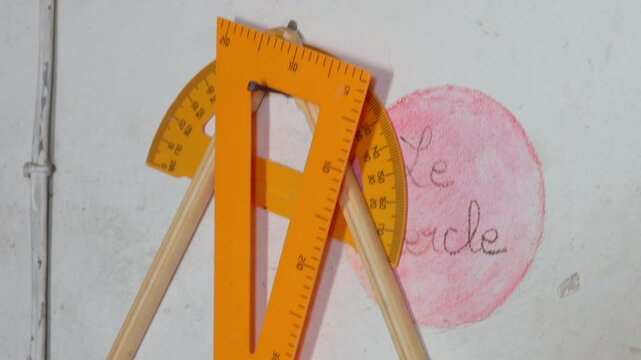 Large triangular ruler, compass and protractor in a classroom in Senegal