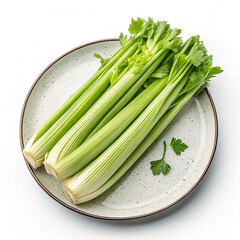 Fresh celery stalks neatly arranged on plate