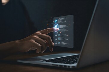 A Close-Up of an Adult Male Hand Interacting with a Futuristic Touchscreen on a Laptop in a Dark Environment, Showcasing Modern Technology and Digital Interaction
