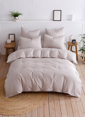 Double bed with a fluffy duvet in a beige duvet cover top view photo
