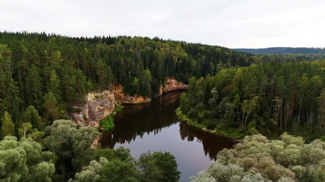 Sandstone Outcrops Of Erglu Cliffs Through Gauja River In Gauja National Park, Latvia. Aerial Drone Shot