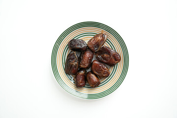 Dates on plate isolated o white background