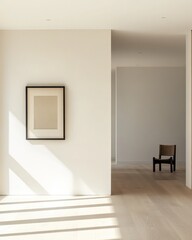 Fototapeta premium Minimalist hallway with sunlight, artwork, and chair.