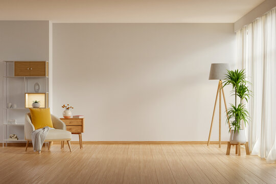 The modern interior living room showcases an armchair and decorative accessories set against a white wall- 3D rendering
