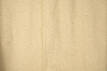 Brown recycled craft paper texture as background. Brown paper texture, Old vintage page or grunge vignette of old newspaper. Hardboard with copy space for text.