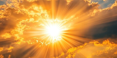 Obraz premium Golden Hour: A breathtaking shot of the sun, ablaze with radiant light, piercing through a tapestry of clouds, creates a scene of warmth and hope.