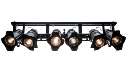 A row of stage lights illuminating a dark performance space