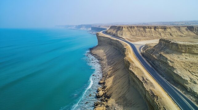 breathtaking image of Makran Coastal Highway winding along rugged coastline of Balochistan dramatic cliff turquoise water stretching horizon scenic highway offer traveler breathtaking view thrilling a