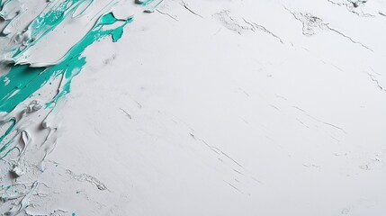 Naklejka premium A dynamic burst of teal-colored powder splashing on a white background, creating an abstract art effect.