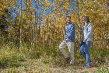 Fototapeta premium Man and woman hike in Colorado Fall