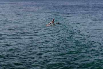 Happy wet woman surfing in the ocean © Cavan