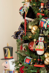 Partial view of Christmas tree decorated with variety of ornaments