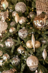 Variety of Christmas decorations on pine tree