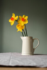 Yellow daffodils in vase. Easter spring background