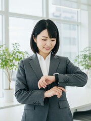 Obraz premium Businesswoman Checking Time on Smartwatch in Modern Office Setting