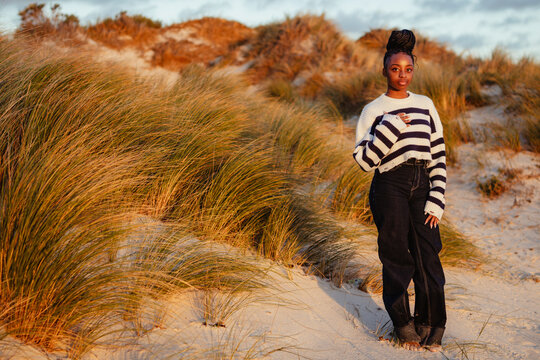Warm toned image of young black women deep in thought