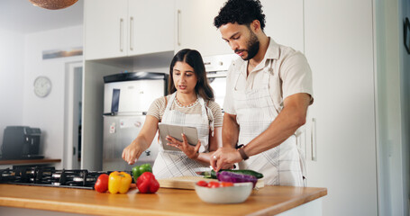 Couple, vegetables or cooking with tablet in kitchen for online recipe, meal instructions or...