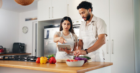 Couple, cooking and tablet with online recipe in kitchen for meal instructions, tutorial guidance...