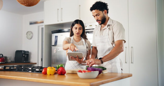 Couple, cooking and tablet with online recipe in kitchen for meal instructions, tutorial guidance or support. People, food blog or cutting ingredients for healthy dinner or nutrition website in home