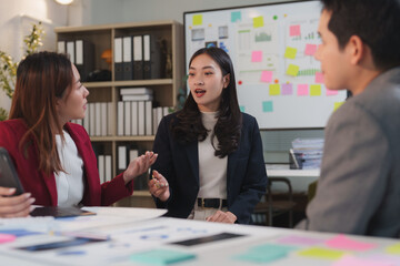 Businesswomen discussing during corporate meeting in modern office