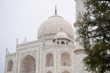 Amazing view of Taj Mahal which is among seven world wonders. Famous Indian Islamic heritage at cloudy day, Taj Mahal located at south bank of the Yamuna River