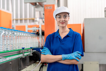 Portrait of Caucasian industry worker working in factory warehouse. 
