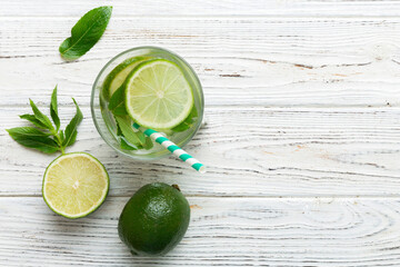 Caipirinha, Mojito cocktail, vodka or soda drink with lime, mint and straw on table background....