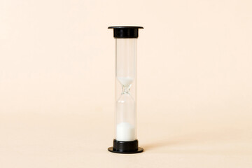 hourglass on the table, sand clock as time passing concept for business deadline, copy space